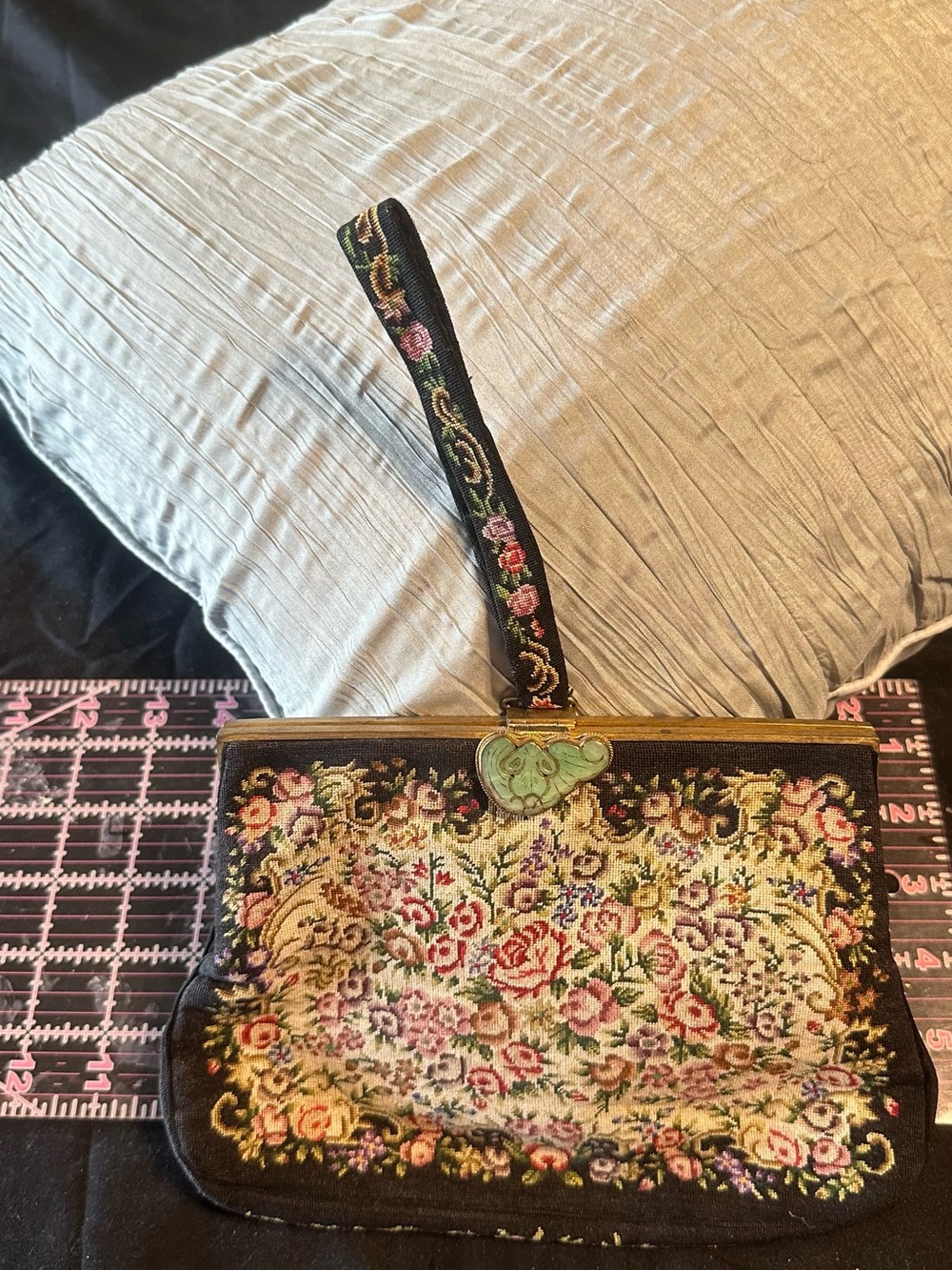 Vintage tapestry handbag with floral needlepoint design, brass and enamel clasp
